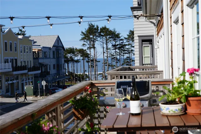 a table and chairs in front of a house