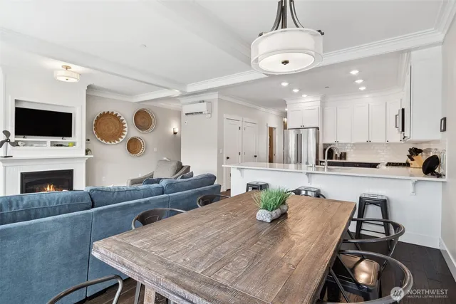 a living room with fireplace furniture and a flat screen tv