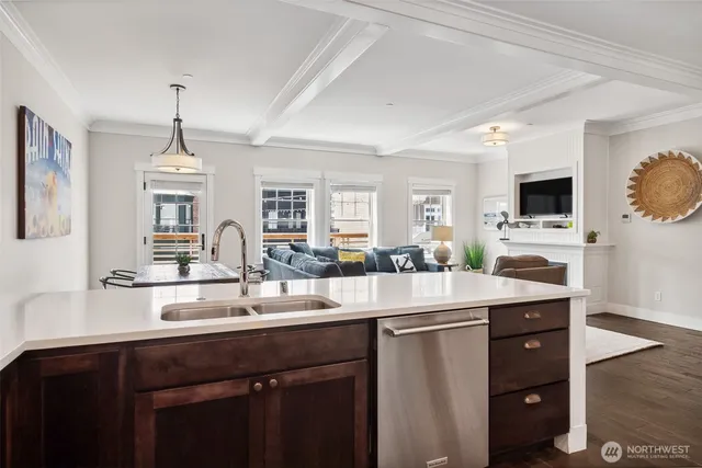 a kitchen with sink stove and cabinets