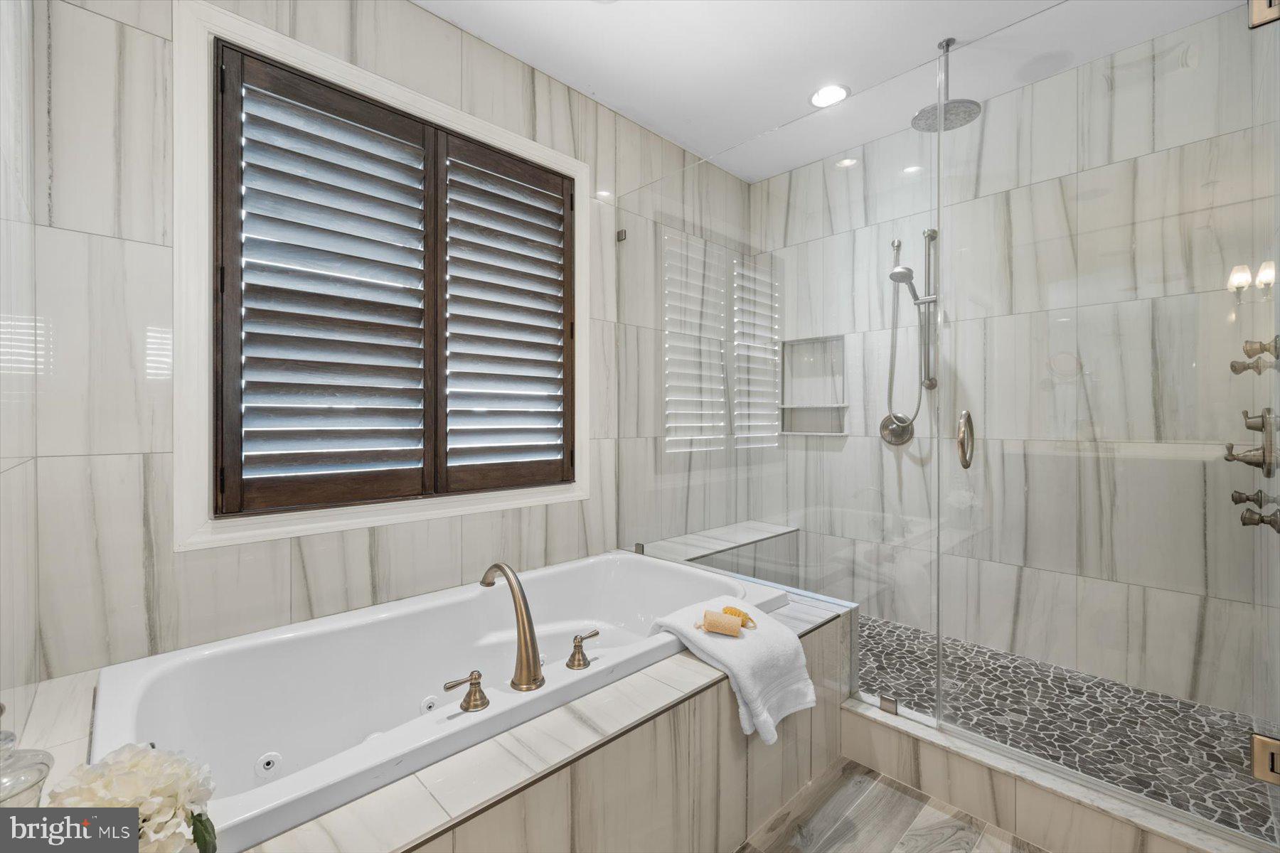 35 Inlet View Court Bethany Beach, DE 19930 - Photo 33 of 74 a bathroom with a bathtub and a shower