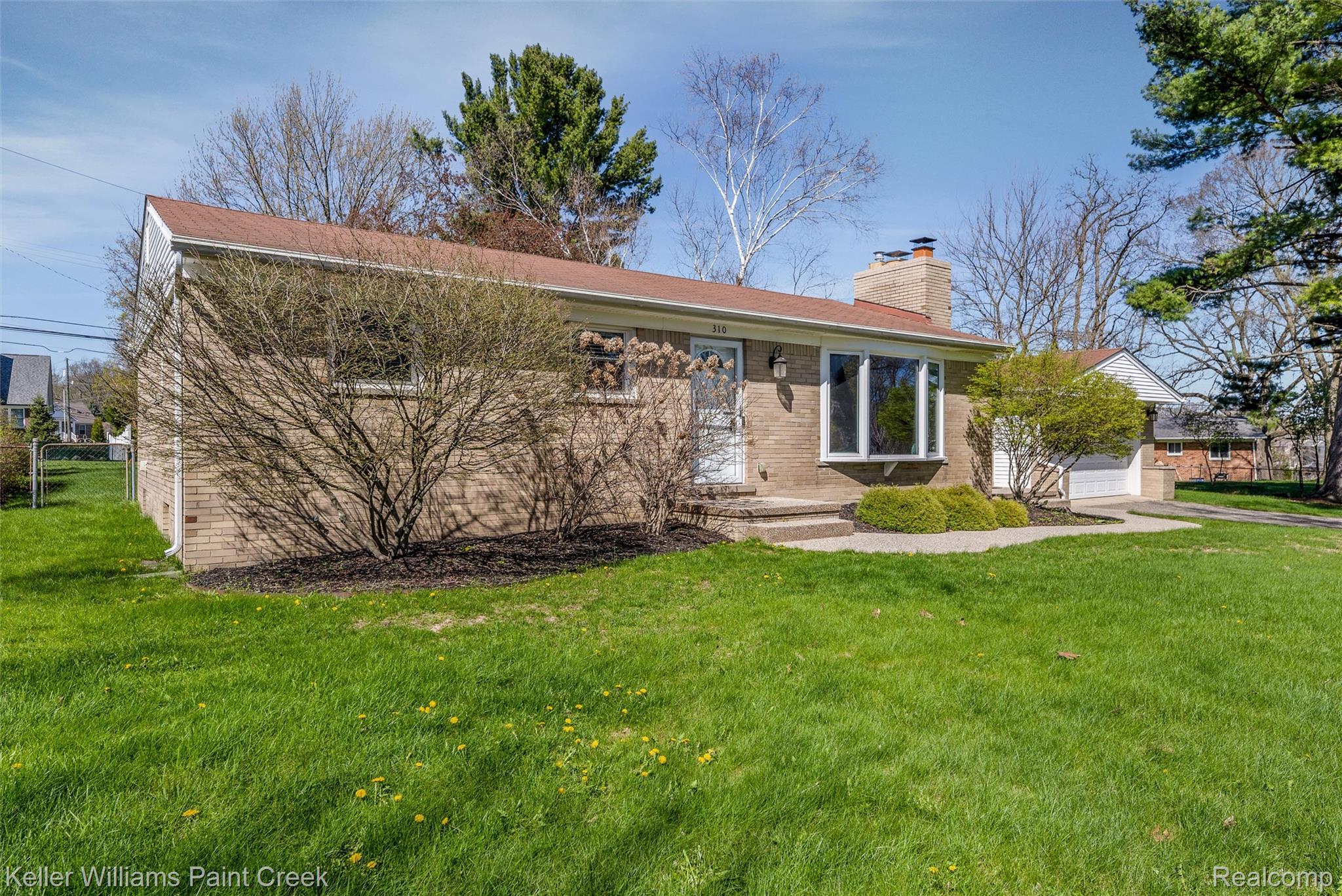 310 Elmhill Road Rochester, MI 48306 - Photo 27 of 37 Single story home featuring a garage, a chimney, and brick siding