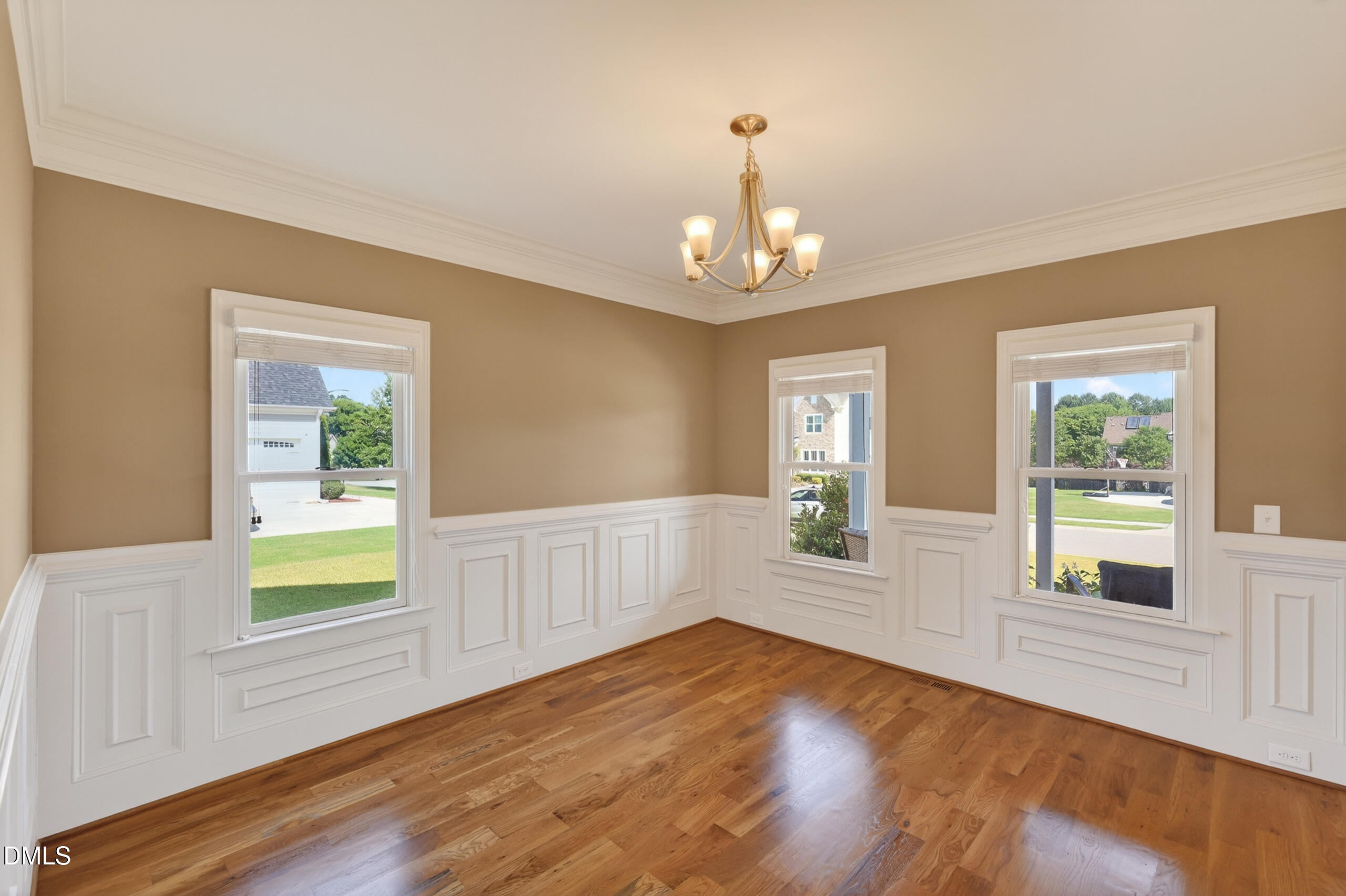 261 Character Drive Rolesville, NC 27571 - Photo 11 of 77 a view of empty room with wooden floor and fan