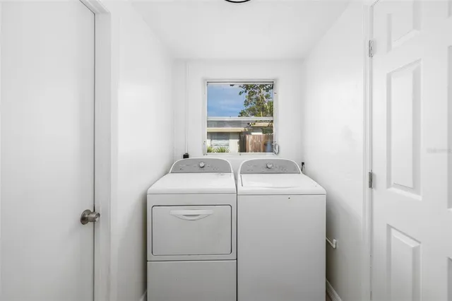 a utility room with dryer and washer