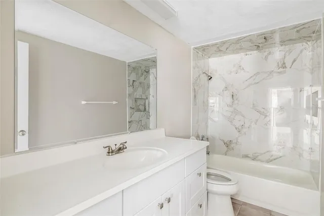 a bathroom with a sink a toilet and a bathtub