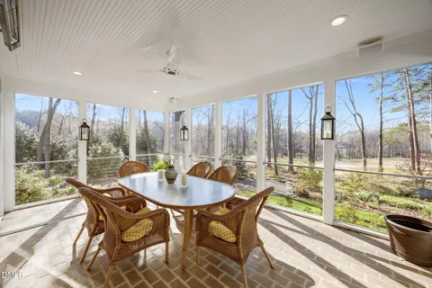 a front view of a house with a yard table and chairs