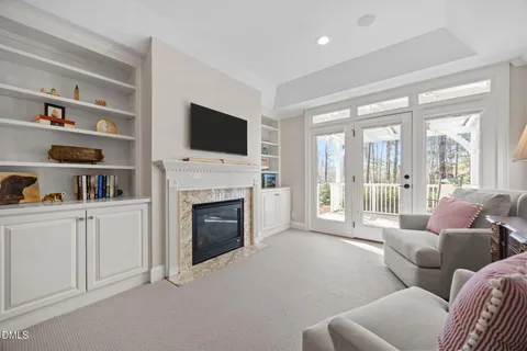 a spacious bedroom with a bed couch and a window