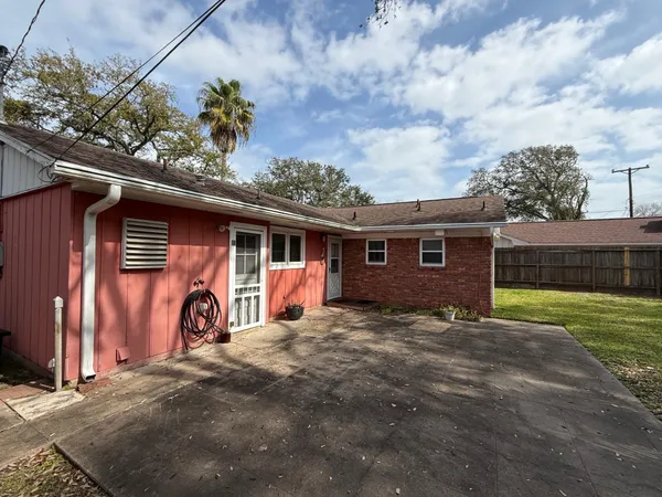 a view of a house with a yard and garage