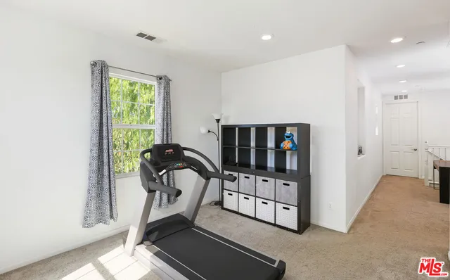 a view of a hallway with workspace