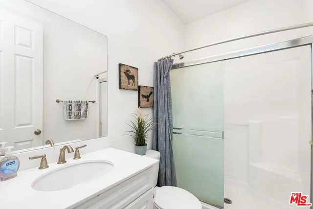 a bathroom with a sink a vanity and mirror