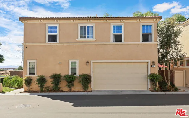 a view of a swimming pool with outdoor seating