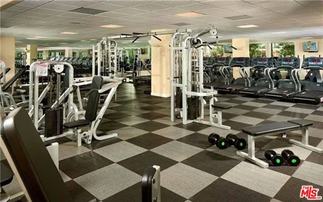 a view of a swimming pool with a patio and a yard