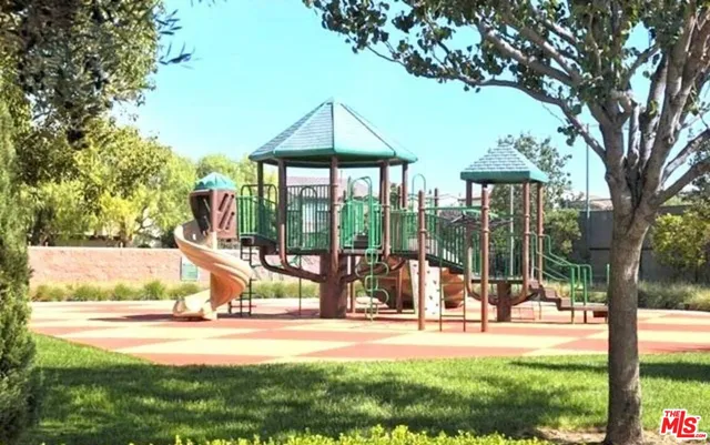 a living room with furniture and a dining table
