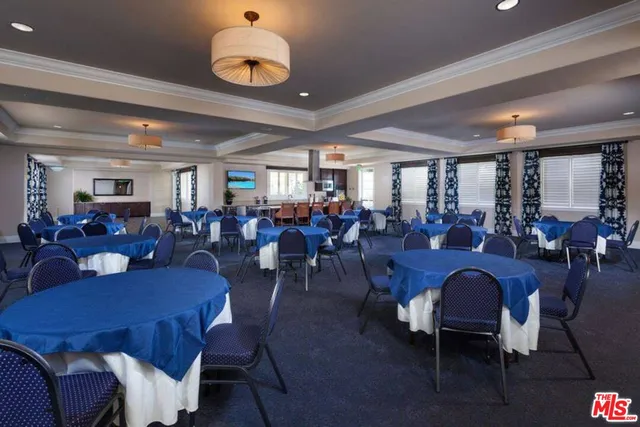 a front view of a residential apartment building with a yard