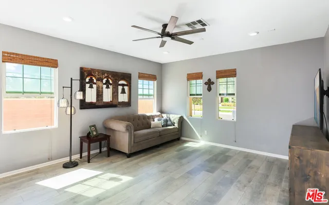 a living room with furniture and a window