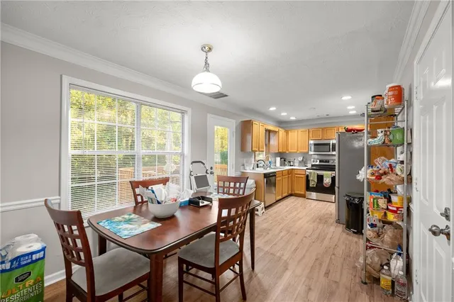 a view of a dining room with furniture window and outside view