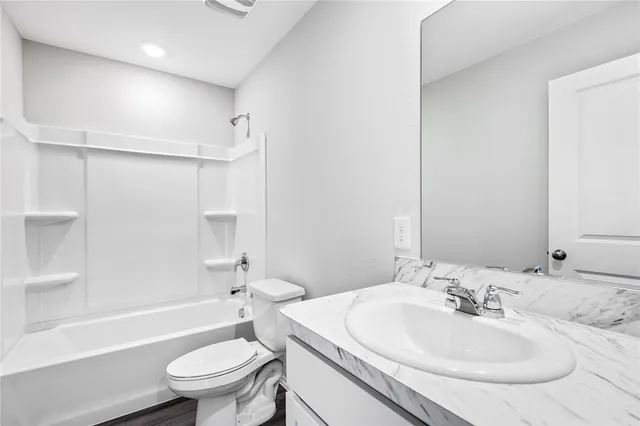 a bathroom with a sink toilet and a bathtub