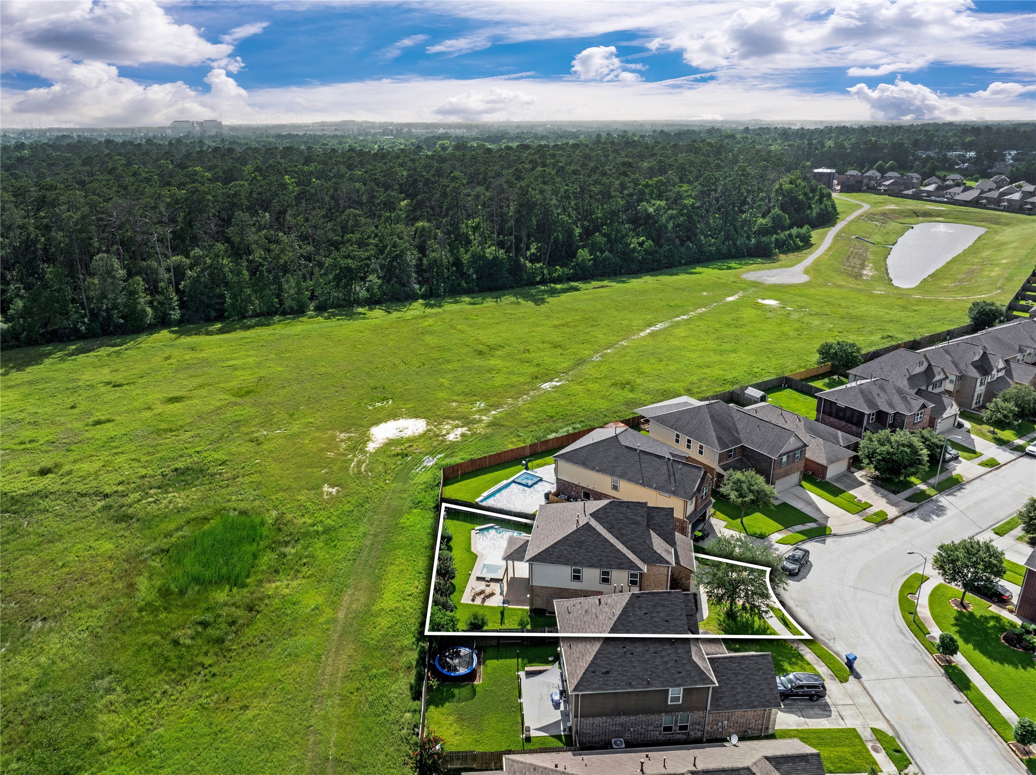 2672 Magnolia Fair Way Spring, TX 77386 - Photo 35 of 49 This spacious lot has everything you need...a pool and spa, covered patio, and grassy space where the kiddos and pets can play.