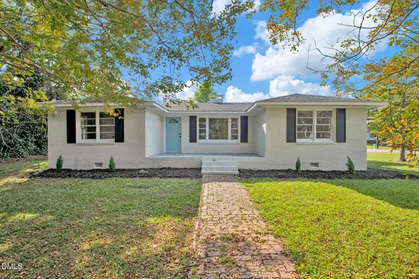 front view of a house with a yard
