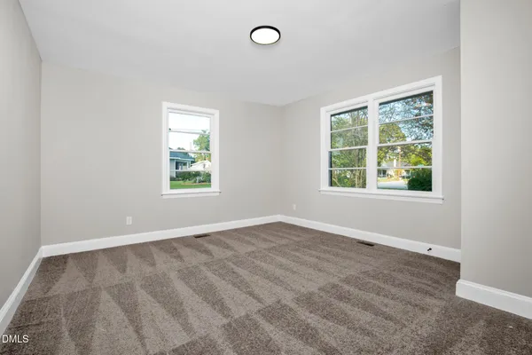 an empty room with windows