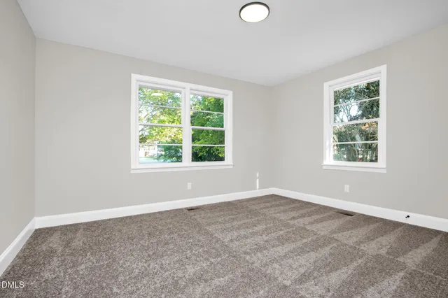 an empty room with windows