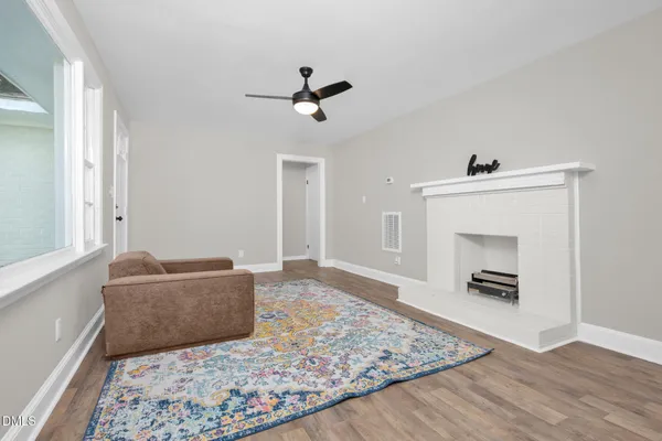 a living room with furniture and a rug