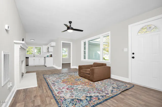 a living room with a couch and a rug