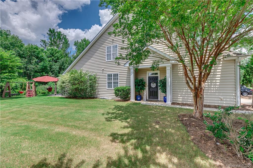 6743 Dusty Saddle Road Charlotte, NC 28277 - Photo 2 of 47 a front view of a house with a yard and trees