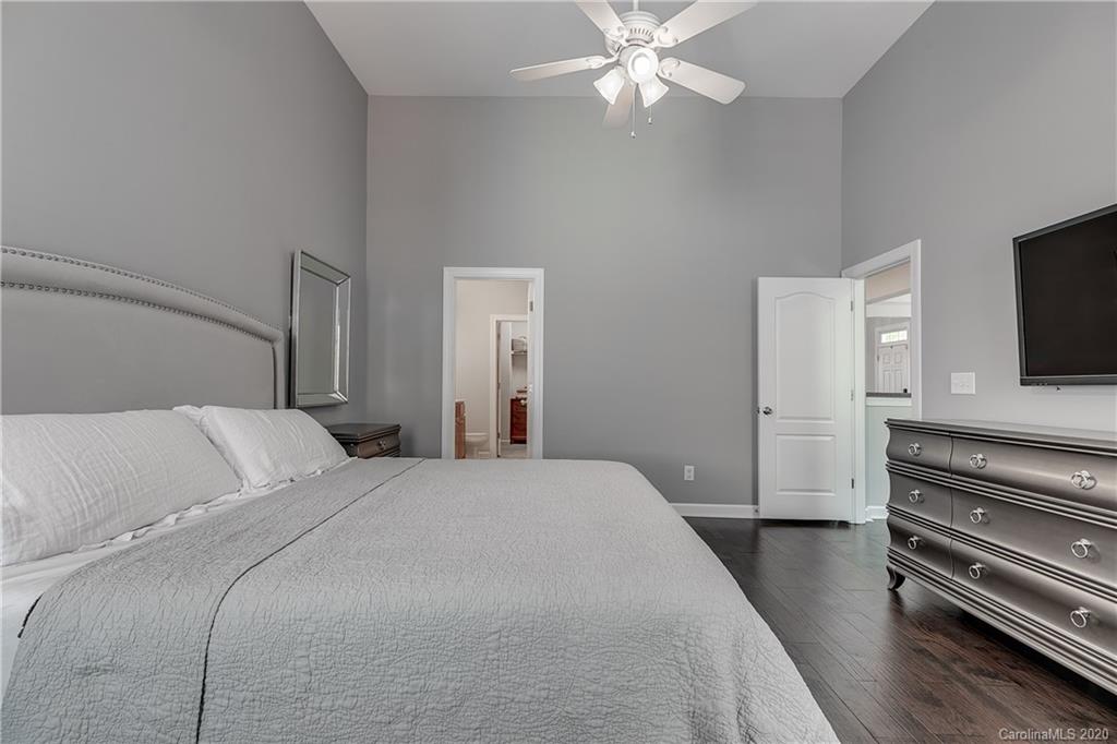 6743 Dusty Saddle Road Charlotte, NC 28277 - Photo 19 of 47 a bedroom with a bed and a flat screen tv