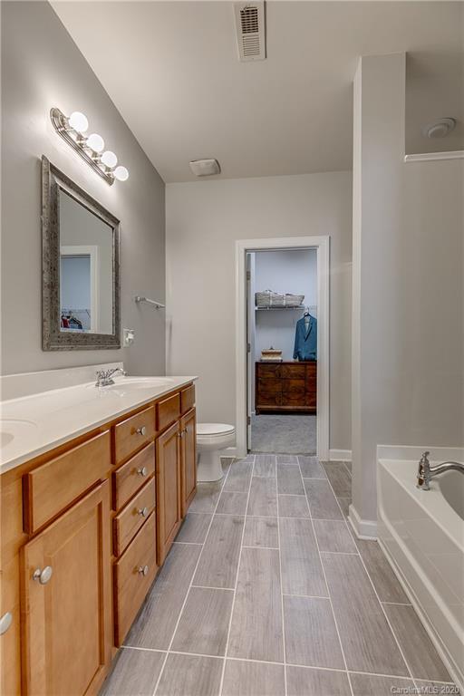 6743 Dusty Saddle Road Charlotte, NC 28277 - Photo 20 of 47 a bathroom with a sink double vanity and a mirror