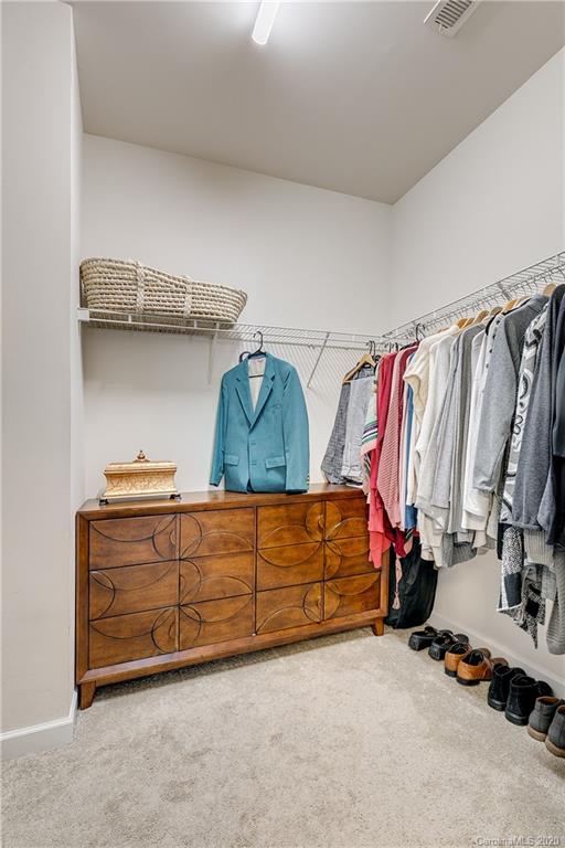 6743 Dusty Saddle Road Charlotte, NC 28277 - Photo 23 of 47 a view of walk in closet with clothes and shoes