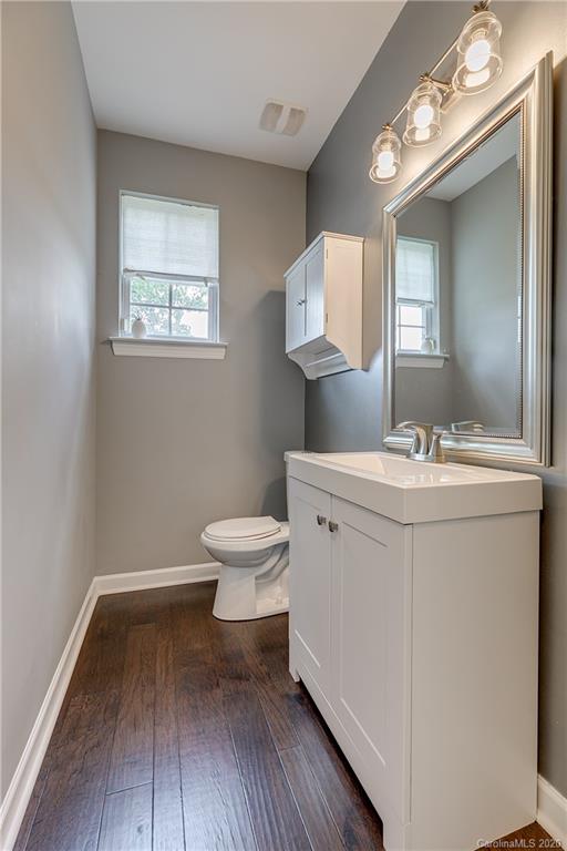 6743 Dusty Saddle Road Charlotte, NC 28277 - Photo 27 of 47 a bathroom with a toilet sink and mirror