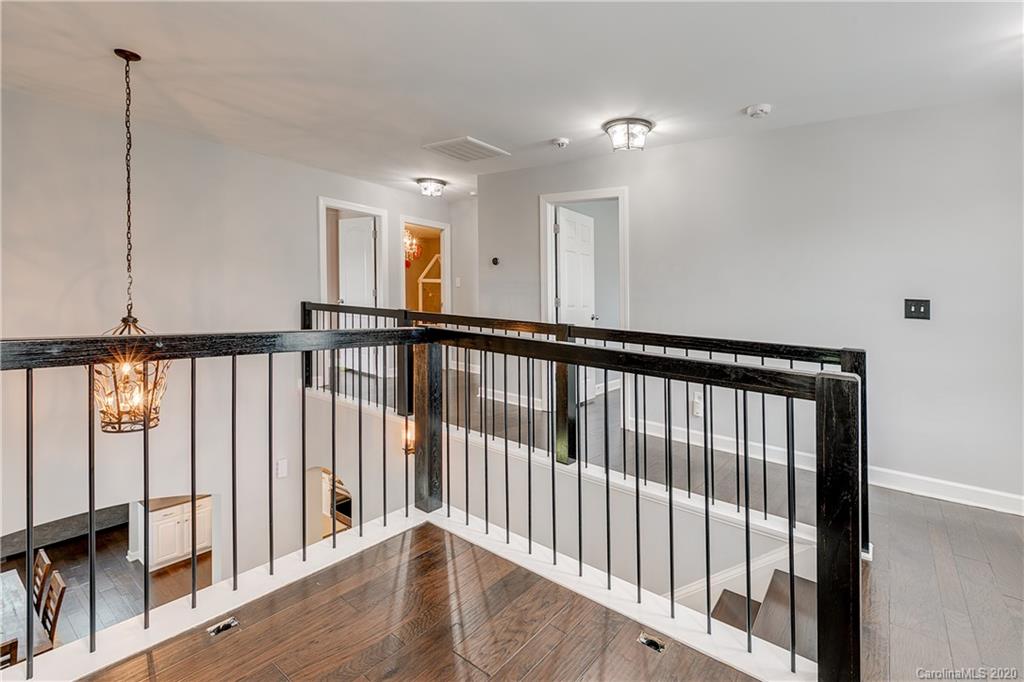 6743 Dusty Saddle Road Charlotte, NC 28277 - Photo 29 of 47 a view of a hallway with wooden floor
