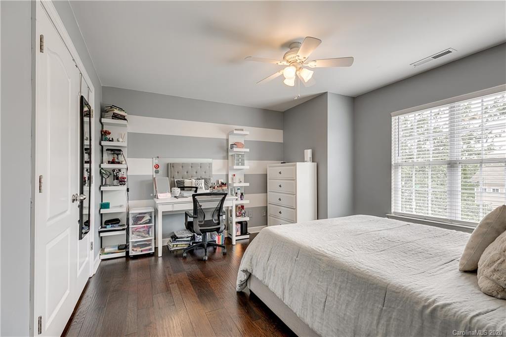 6743 Dusty Saddle Road Charlotte, NC 28277 - Photo 31 of 47 a bedroom with a bed and a large window