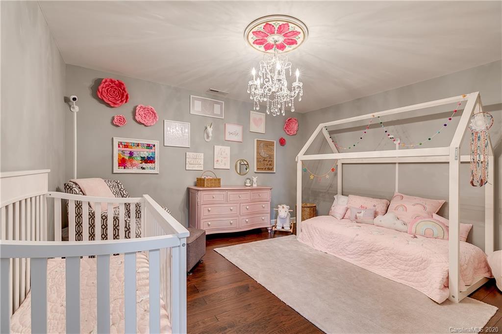 6743 Dusty Saddle Road Charlotte, NC 28277 - Photo 33 of 47 a bedroom with furniture and a chandelier