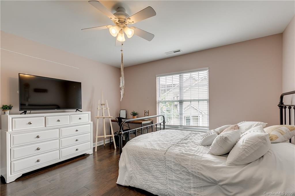 6743 Dusty Saddle Road Charlotte, NC 28277 - Photo 36 of 47 a bedroom with a bed and a flat screen tv