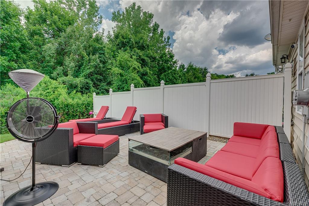 6743 Dusty Saddle Road Charlotte, NC 28277 - Photo 40 of 47 a view of a patio with couches chairs and a fire pit