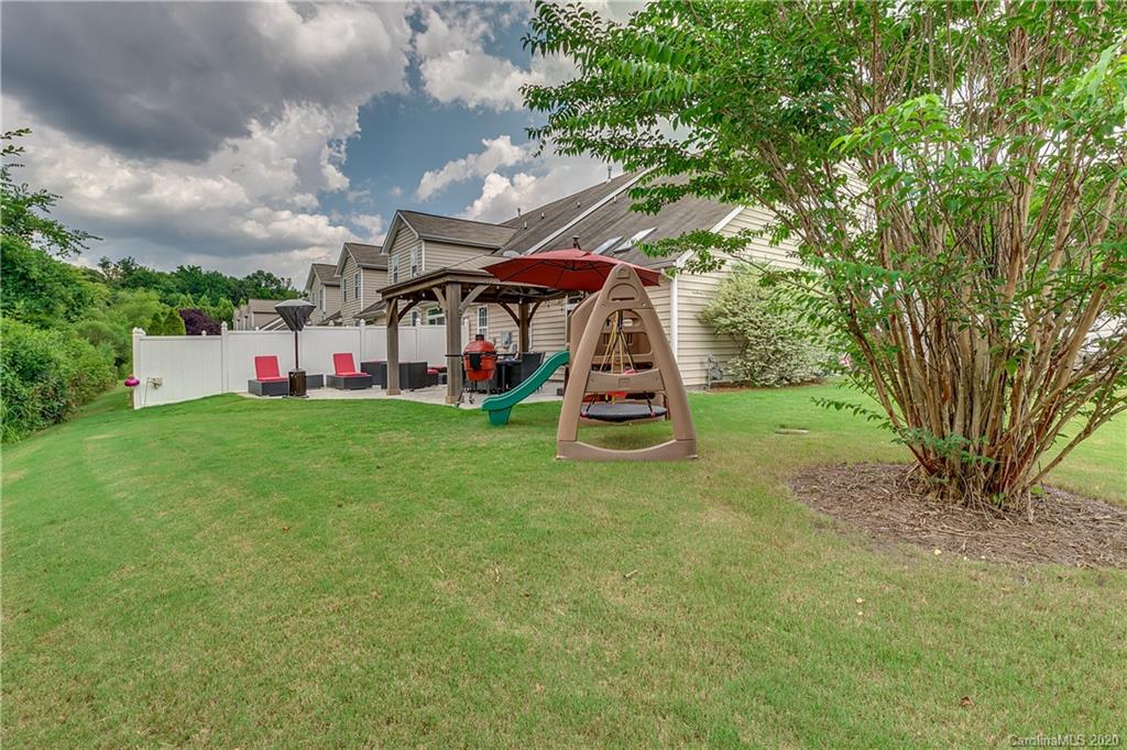 6743 Dusty Saddle Road Charlotte, NC 28277 - Photo 43 of 47 a view of a house with a backyard porch and sitting area