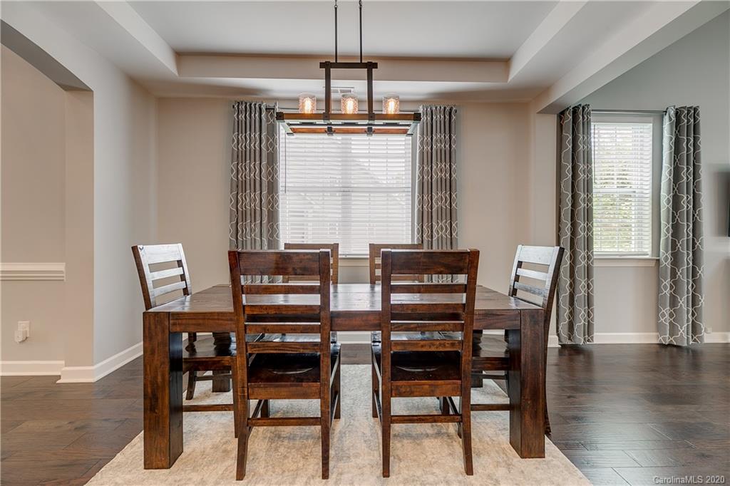 6743 Dusty Saddle Road Charlotte, NC 28277 - Photo 6 of 47 a view of a dining room with furniture window and wooden floor