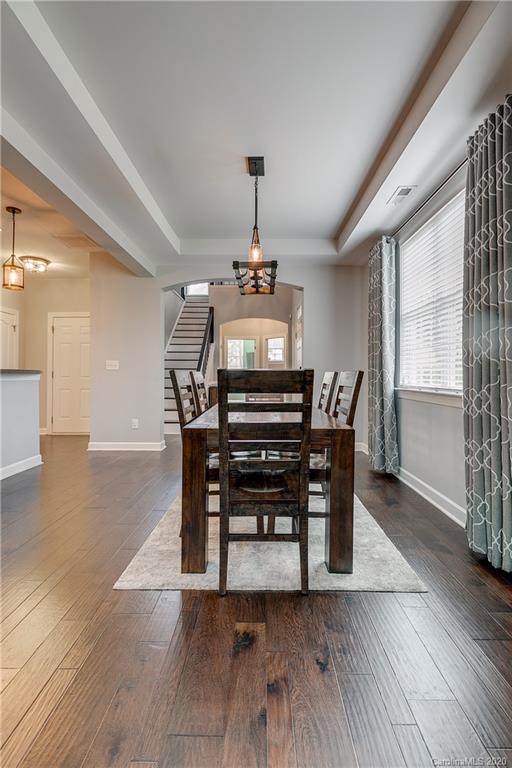 6743 Dusty Saddle Road Charlotte, NC 28277 - Photo 7 of 47 a view of a dining room with furniture window and wooden floor
