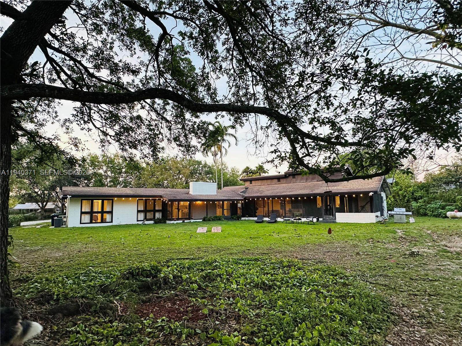 16470 Southwest 234th Street Homestead, FL 33031 - Photo 18 of 21 a view of a house with a yard