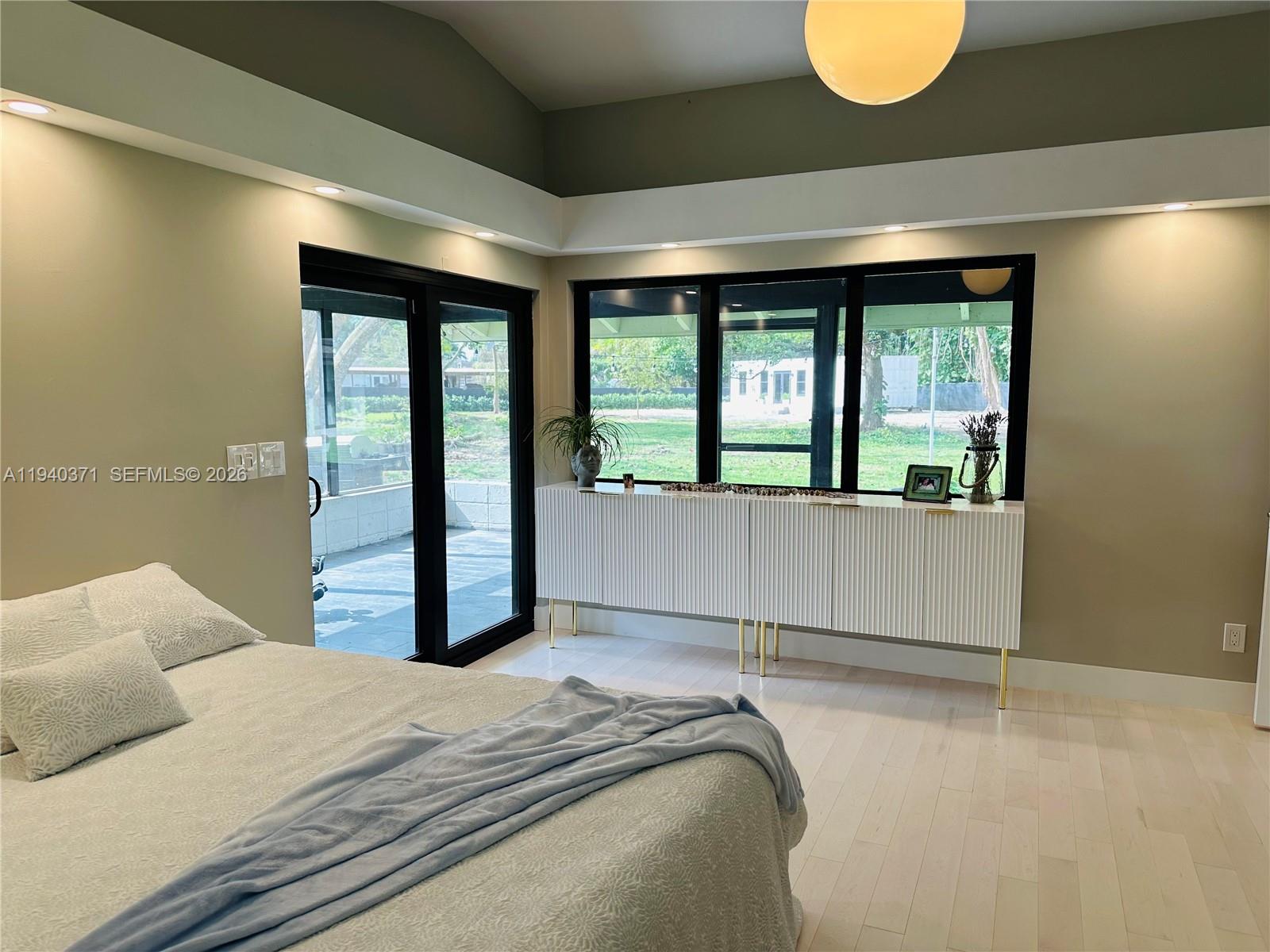 16470 Southwest 234th Street Homestead, FL 33031 - Photo 7 of 21 a bedroom with a large bed and a large window