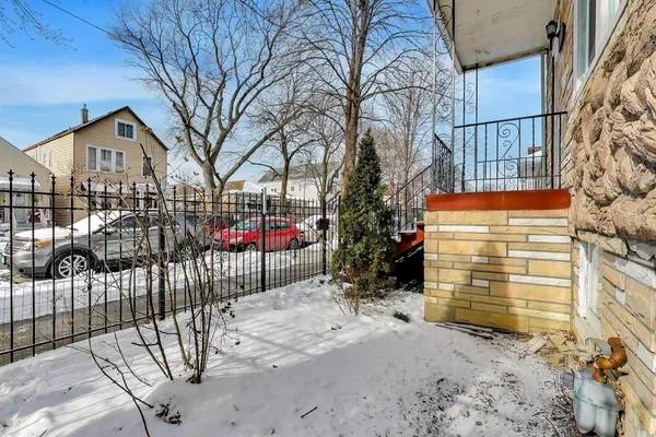 a view of a wrought iron fences in front of house