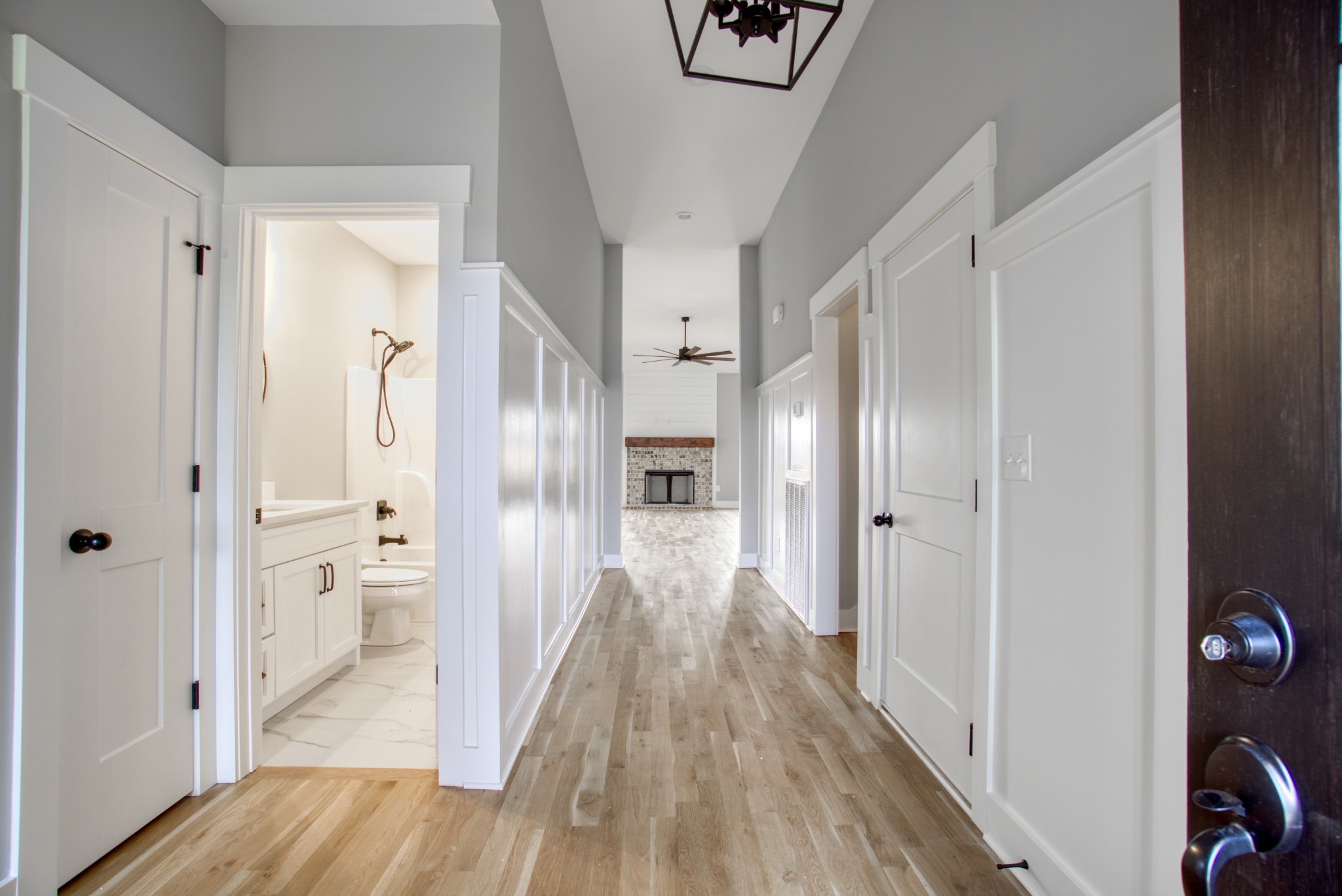 5691 Minnis Road Springfield, TN 37172 - Photo 5 of 19 a view of a hallway with wooden floor and a bathroom