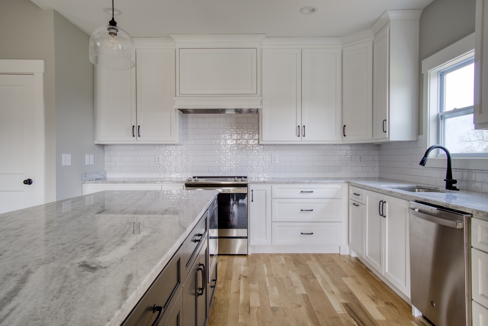 5691 Minnis Road Springfield, TN 37172 - Photo 7 of 19 a kitchen with granite countertop a sink stove and cabinets