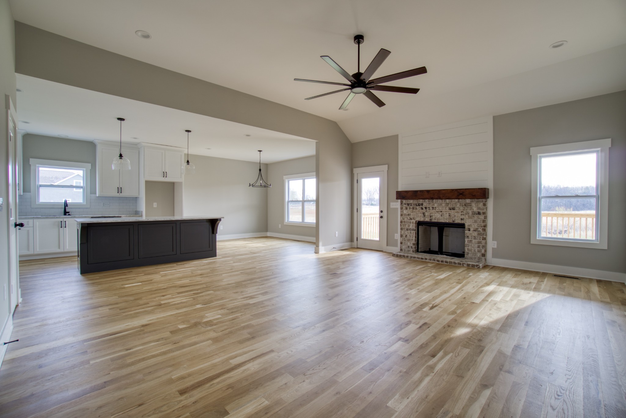 5691 Minnis Road Springfield, TN 37172 - Photo 8 of 19 a view of empty room with wooden floor and fireplace