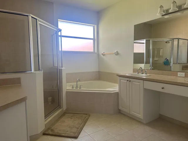 a bathroom with a bathtub and a sink