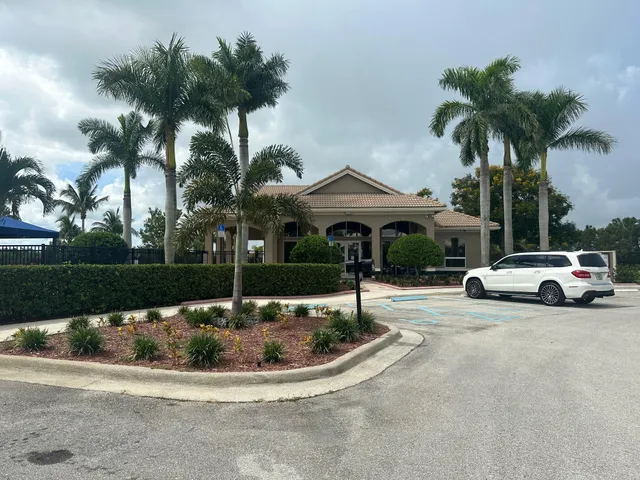 a view of a street with a car parked