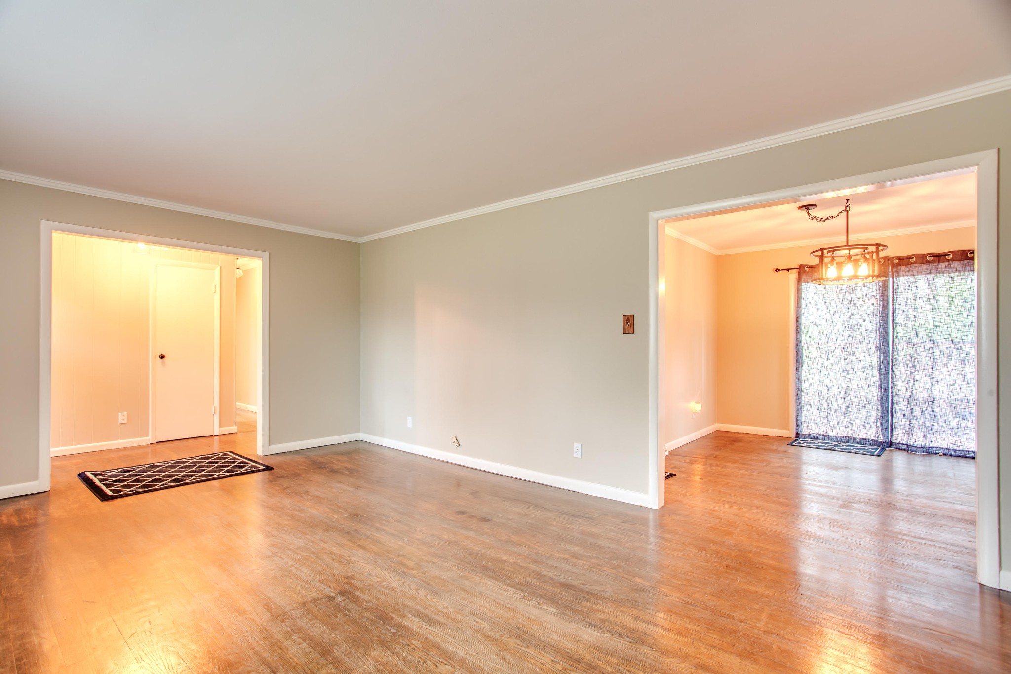 100 Culver Road Oak Ridge, TN 37830 - Photo 3 of 22 an empty room with wooden floor and windows