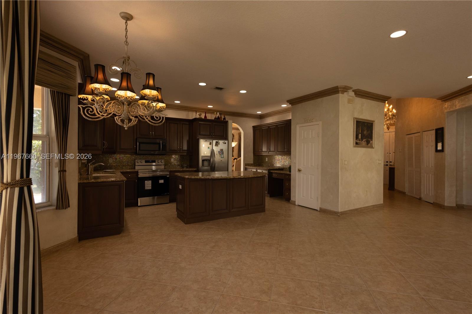 5331 Southwest 159th Avenue, Unit 5331 Miramar, FL 33027 - Photo 11 of 41 a kitchen with refrigerator and window