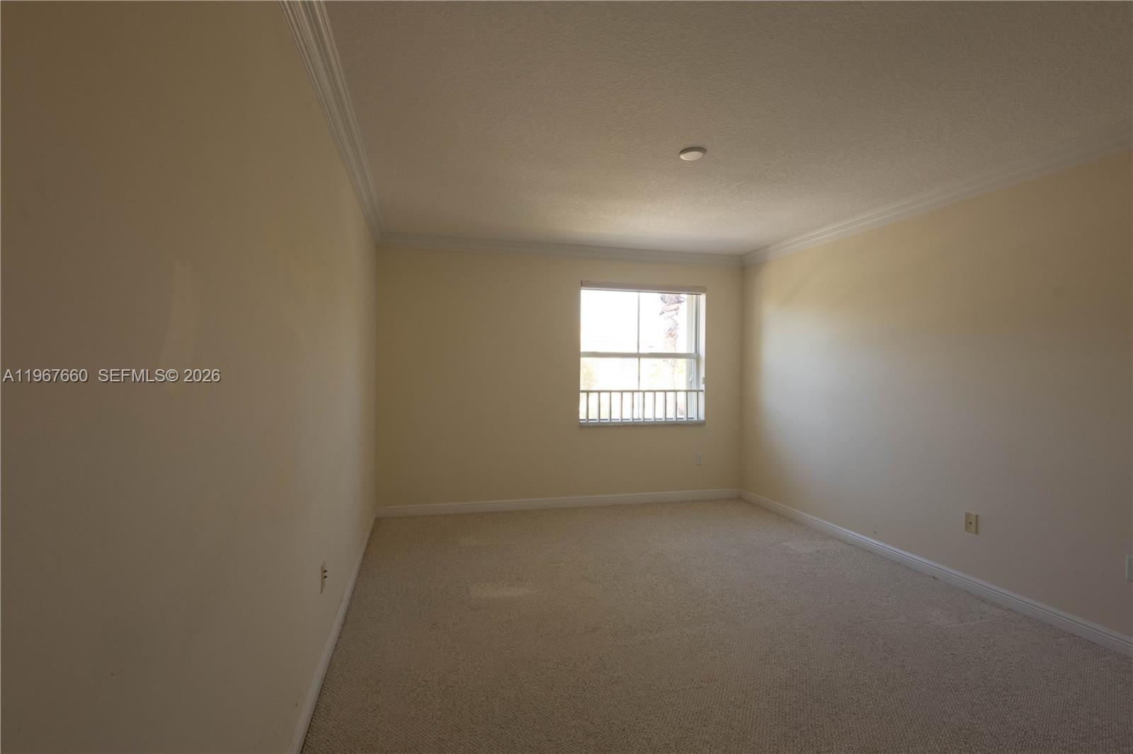 5331 Southwest 159th Avenue, Unit 5331 Miramar, FL 33027 - Photo 16 of 41 an empty room with a window